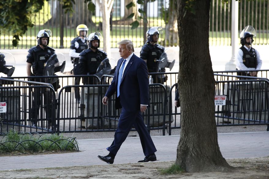 President Donald Trump walks in Lafayette Park to visit outside St. John&#39;s Church across from the White House Monday, June 1, 2020, in Washington. Part of the church was set on fire during protests on Sunday night. (AP Photo/Patrick Semansky)