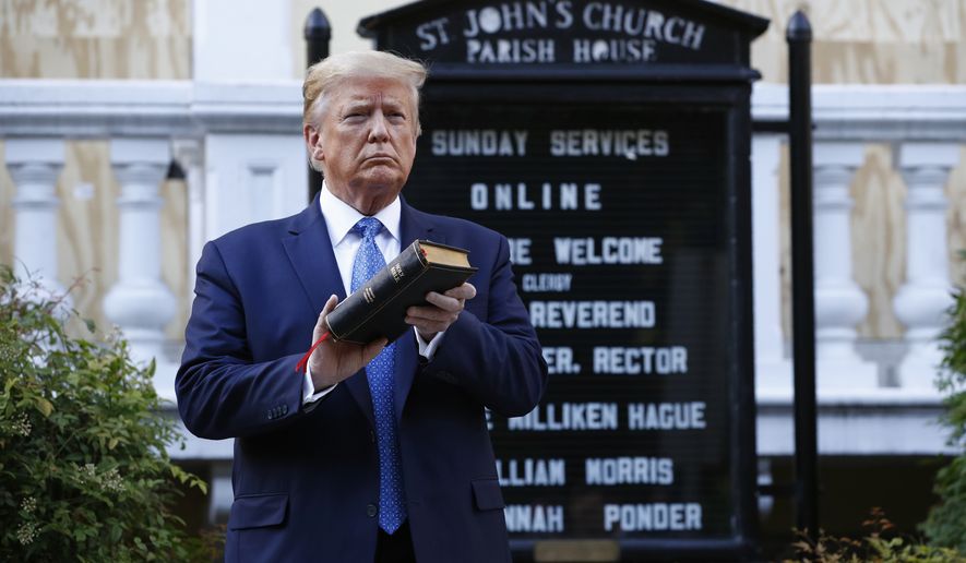 President Donald Trump holds a Bible as he visits outside St. John&#39;s Church across Lafayette Park from the White House Monday, June 1, 2020, in Washington. Part of the church was set on fire during protests on Sunday night. (AP Photo/Patrick Semansky)