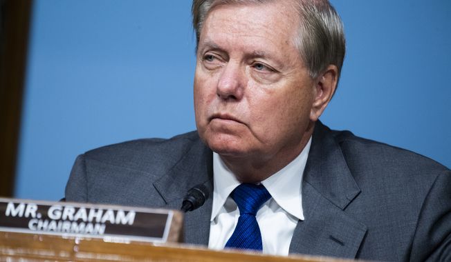 Chairman Lindsey Graham, R-S.C., listens during a Senate Judiciary Committee hearing examining issues facing prisons and jails during the coronavirus pandemic on Capitol Hill in Washington, Tuesday,  June 2, 2020. (Tom Williams/CQ Roll Call/Pool via AP)