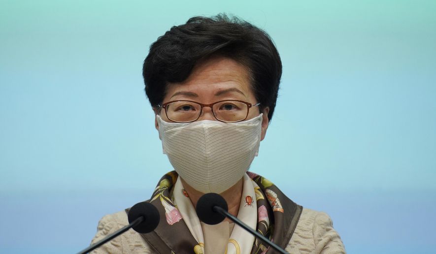 Hong Kong Chief Executive Carrie Lam listens to reporters questions during a press conference in Hong Kong, Tuesday, June 2, 2020. Lam hit out at the &amp;quot;double standards&amp;quot; of foreign governments over national security, and pointed to recent unrest in America as an example. (AP Photo/Vincent Yu)