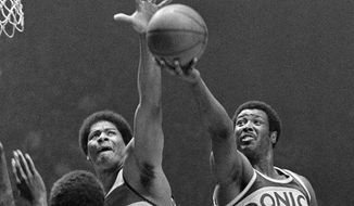 FILE - In this May 25, 1979, file photo, Washington Bullets&#39; Wes Unseld (41) reaches to block a shot by Seattle Supersonics&#39; Paul Silas ()35) during an NBA basketball game in Landover, Md. Unseld, the Hall of Fame center who led Washington to its only NBA championship and was chosen one of the 50 greatest players in league history, died Tuesday, June 2, 2020, after a series of health issues, most recently pneumonia. He was 74. (AP Photo/Smith, File)