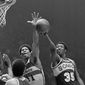 FILE - In this May 25, 1979, file photo, Washington Bullets&#39; Wes Unseld (41) reaches to block a shot by Seattle Supersonics&#39; Paul Silas ()35) during an NBA basketball game in Landover, Md. Unseld, the Hall of Fame center who led Washington to its only NBA championship and was chosen one of the 50 greatest players in league history, died Tuesday, June 2, 2020, after a series of health issues, most recently pneumonia. He was 74. (AP Photo/Smith, File)