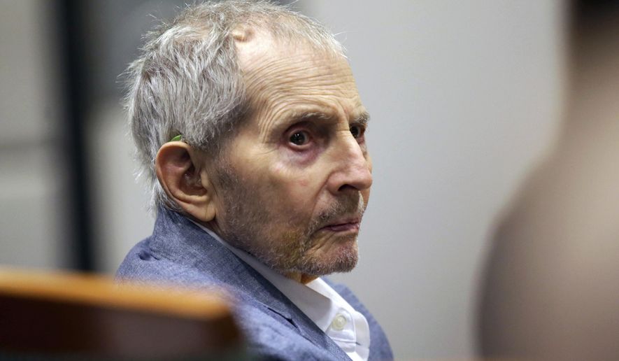 FILE - In this March 10, 2020, file photo, real estate heir Robert Durst looks over during his murder trial in Los Angeles. Los Angeles County prosecutors are opposing a motion from Durst for a mistrial in the murder trial of the 77-year-old New York real estate heir. Prosecutors say in their motion Tuesday, June 2, 2020, that Durst is using the coronavirus pandemic to further delay facing a charge of killing his best friend, Susan Berman, in her Beverly Hills home in 2000, and jurors will be perfectly able to resume their duties. Durst has denied any role in the killing. (AP Photo/Alex Gallardo, Pool, File)