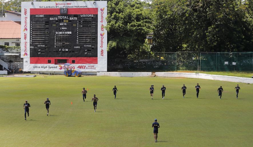 Members of Sri Lankan cricket team attend their first training session after more than two months of restrictions to prevent the spread of the new coronavirus in Colombo, Sri Lanka, Tuesday, June 2, 2020. (AP Photo/Eranga Jayawardena)