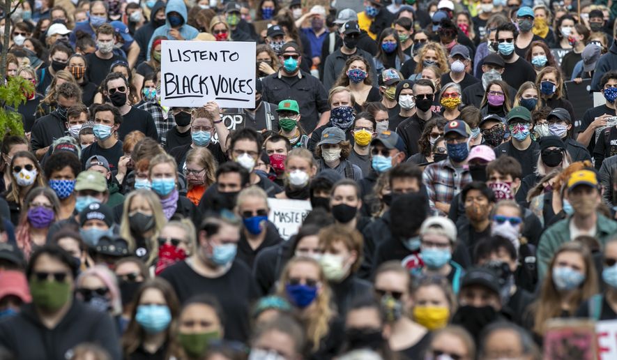 Demonstrators gather at a rally to peacefully protest and demand an end to institutional racism and police brutality, Wednesday, June 3, 2020, in Portland, Maine. (AP Photo/Robert F. Bukaty)