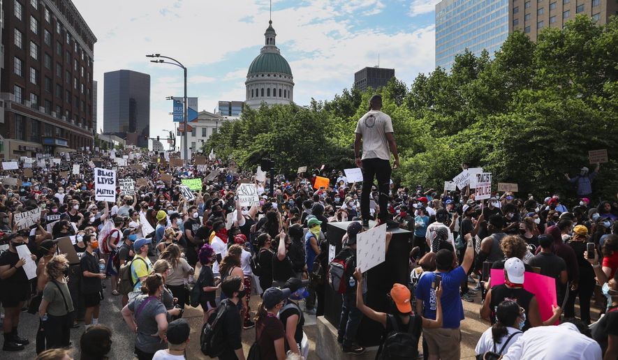 Protesters fill Market Street near the Gateway Arch grounds during an event organized by ExpectUS in St. Louis on Monday, June 1, 2020. Protesters were demonstrating against the death of George Floyd, who died May 25 after being detained by Minneapolis police. (Colter Peterson/St. Louis Post-Dispatch via AP)