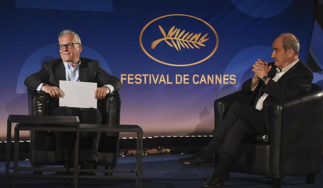 Cannes Festival director Thierry Fremaux, left, festival president Pierre Lescure, sit during the presentation of the festival lineup, in an empty cinema Wednesday, June 3, 2020 in Paris. The Cannes Film Festival was canceled due to the pandemic but it announced the films that would have played at the French Riviera festival. Those films, festival organizers say, will be able to promote themselves with the Cannes &amp;quot;stamp of approval.&amp;quot; (Serge Arnal, Pool via AP)