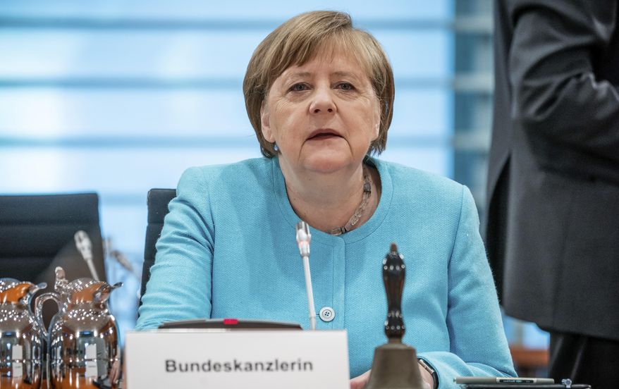 German Chancellor Angela Merkel attends the weekly cabinet meeting at the Chancellery in Berlin, Germany, Wednesday, June 3, 2020. (Michael Kappeler/DPA via AP, Pool)