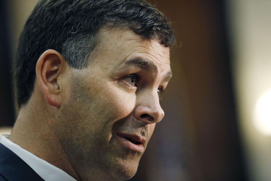 Secretary of State Michael Watson speaks to members of the Senate and House Elections Committees during a joint hearing at the Mississippi State Capitol in Jackson, Miss., Wednesday, June 3, 2020. (AP Photo/Rogelio V. Solis)