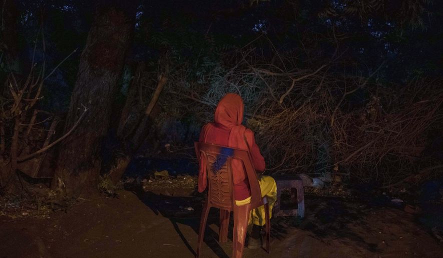 This Jan. 12, 2020 photo shows 22-year-old Mayada, a tea vendor 7-months pregnant with twins, the result of a gang-rape by Sudanese security forces, in Khartoum, Sudan. Dozens of women were raped on June 3, 2019 as security forces attacked a sit-in protest camp in Khartoum, according to activists’ counts. Mayada wanted to end the pregnancy, but a pharmacist refused to sell her pills to cause an abortion. She hurt herself, lifting heavy objects and throwing herself off furniture, hoping for a miscarriage. She gave birth in March to a daughter, while the other twin, a boy, died. She doesn’t know the names of the men who raped her, much less which is the father. (AP Photo/Nariman El-Mofty)