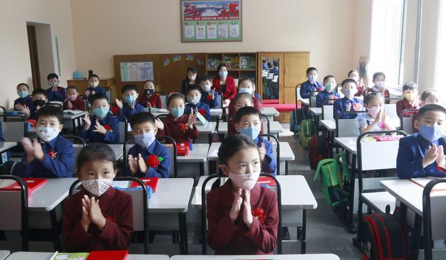 Students wearing face masks take a class at Kim Song Ju Primary School in Pyongyang, North Korea, Wednesday, June 3, 2020. All the schools in the country start their lessons this month after delays over concern about the new coronavirus. (AP Photo/Cha Song Ho)  **FILE**
