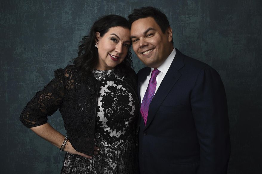 FILE - In this Jan. 27, 2020 file photo, Kristen Anderson-Lopez, left, and Robert Lopez pose for a portrait at the 92nd Academy Awards Nominees Luncheon in Los Angeles. The husband-and-wife songwriting duo of Kristen Anderson-Lopez and Bobby Lopez are just some of the luminaries who have signed on to give master classes and advise fledgling artists as a way to benefit the nonprofit TheaterWorksUSA. (AP Photo/Chris Pizzello, File)