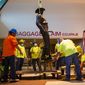 A Phoenix 1 Restoration &amp; Construction crew removes a 12-foot-tall bronze statue of a Texas Ranger, called One Riot, One Ranger,  from the main lobby inside Love Field airport on Thursday, June 4, 2020 in Dallas. A published account of brutal and racist chapters in the history of an elite Texas investigative agency prompted Dallas officials to remove the statue from Love Fields passenger terminal that honored the agency. (Juan Figueroa/ The Dallas Morning News via AP)