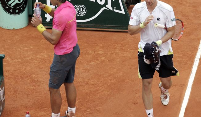 FILE - In this May 31, 2009, file photo, Sweden&#x27;s Robin Soderling, right, and defending champion Spain&#x27;s Rafael Nadal walk back to their seats during their fourth round match of the French Open tennis tournament at the Roland Garros stadium in Paris. Soderling won 6-2, 6-7 (2), 6-4, 7-6 (2).  It wasn&#x27;t just that Nadal was unbeaten through 31 matches at the French Open and considered a lock to become the first man with five consecutive titles there. It&#x27;s also that Soderling never had been past the second round at any major.(AP Photo/Christophe Ena, File)