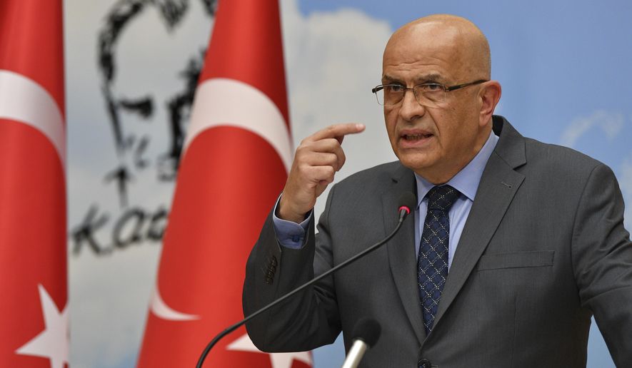 Enis Berberoglu, a legislator of Turkey's main opposition Republican People's Party, or CHP, speaks at a news conference in Ankara, Turkey, Thursday, June 4, 2020. Turkey's parliament on Thursday stripped three opposition party deputies, including Berberoglu, of their legislative seats, setting off a raucous protest inside the assembly hall by colleagues who accused the ruling party of an assault on democracy. (AP Photo)