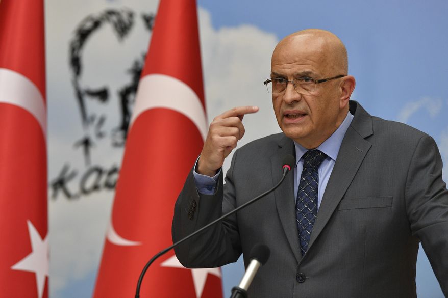 Enis Berberoglu, a legislator of Turkey's main opposition Republican People's Party, or CHP, speaks at a news conference in Ankara, Turkey, Thursday, June 4, 2020. Turkey's parliament on Thursday stripped three opposition party deputies, including Berberoglu, of their legislative seats, setting off a raucous protest inside the assembly hall by colleagues who accused the ruling party of an assault on democracy. (AP Photo)