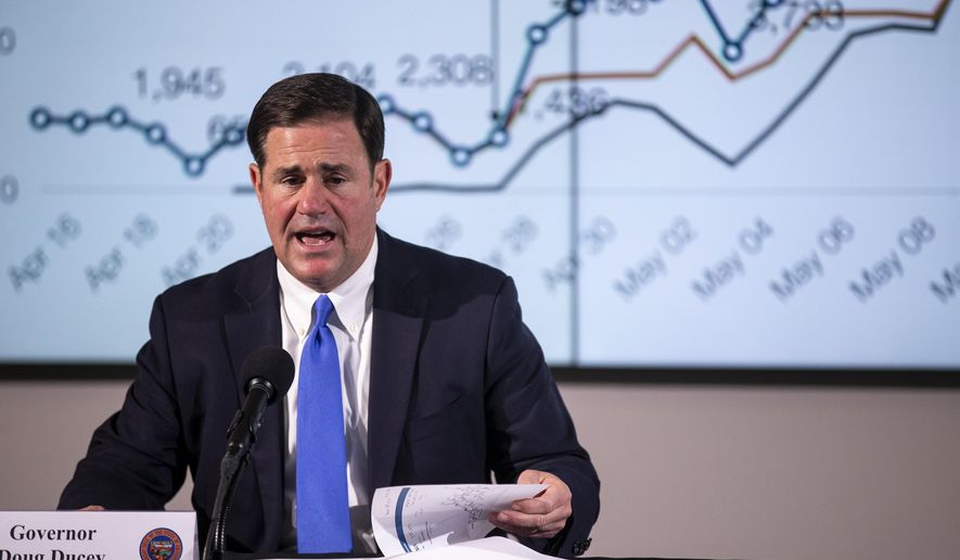 Arizona Gov. Doug Ducey speaks at a press conference about protests and COVID-19 in Arizona Thursday, June 4, 2020, at the Arizona Commerce Authority Conference Center in Phoenix. (Sean Logan/The Arizona Republic via AP, Pool)