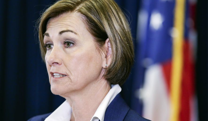 Iowa Gov. Kim Reynolds updates the state's response to the coronavirus outbreak during a news conference at the Statehouse in Des Moines, Iowa, on Thursday, June 4, 2020. (Jim Slosiarek/The Gazette via AP, Pool)