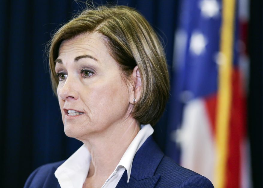 Iowa Gov. Kim Reynolds updates the state's response to the coronavirus outbreak during a news conference at the Statehouse in Des Moines, Iowa, on Thursday, June 4, 2020. (Jim Slosiarek/The Gazette via AP, Pool)