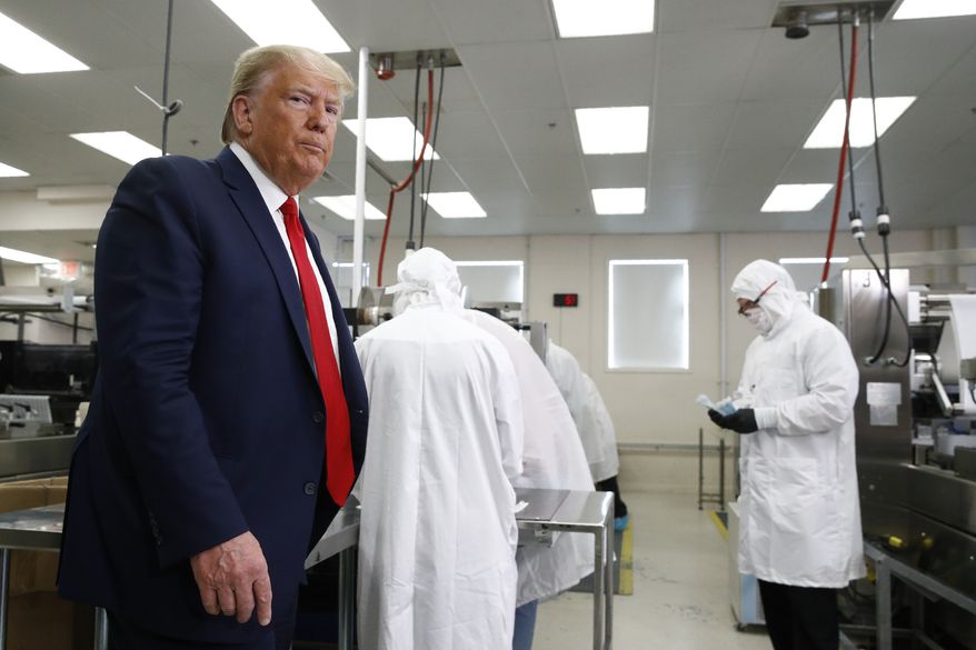President Donald Trump tours Puritan Medical Products medical swab manufacturing facility, Friday, June 5, 2020, in Guilford, Maine. (AP Photo/Patrick Semansky)