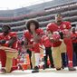 FILE - In this Oct. 2, 2016, file photo, from left, San Francisco 49ers outside linebacker Eli Harold, quarterback Colin Kaepernick and safety Eric Reid kneel during the national anthem before an NFL football game against the Dallas Cowboys in Santa Clara, Calif. When Colin Kaepernick took a knee during the national anthem to take a stand against police brutality, racial injustice and social inequality, he was vilified by people who considered it an offense against the country, the flag and the military. Nearly four years later, it seems more people are starting to side with Kaepernick’s peaceful protest and now are calling out those who don’t understand the intent behind his action. (AP Photo/Marcio Jose Sanchez, File)
