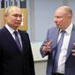 In this file pool photo taken on Tuesday, Dec. 3, 2019, Vladimir Potanin, the billionaire owner of a nickel giant, right, gestures while speaking to Russian President Vladimir Putin in Sochi, Russia. Mr. Potanin is one of the targets of a new Twitter account, @RUOligarchJets, that tracks the whereabouts of aircraft owned by Russian oligarchs. (Mikhail Klimentyev, Sputnik, Kremlin Pool Photo via AP, File) **FILE**