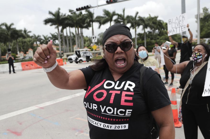 Gail Jones chants during a protest over the death of George Floyd outside of the Trump National Doral, Saturday, June 6, 2020, in Doral, Fla. Protests continue over the death of Floyd, a black man who died after he was restrained while in police custody in Minneapolis. (AP Photo/Lynne Sladky)