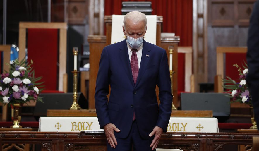 In this file photo, Democratic presidential candidate, former Vice President Joe Biden bows his head in prayer during a visit to Bethel AME Church in Wilmington, Del., Monday, June 1, 2020. (AP Photo/Andrew Harnik)