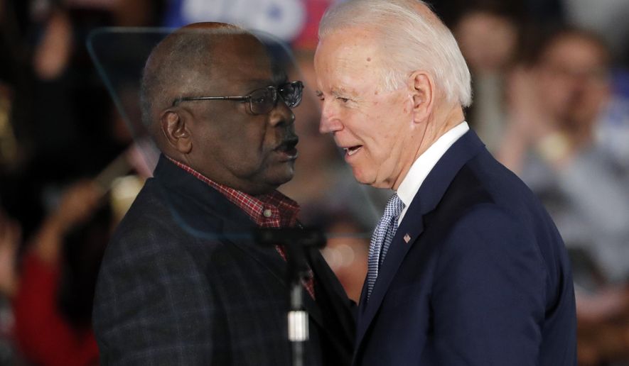 Democratic presidential candidate former Vice President Joe Biden talks to Rep. James Clyburn, D-S.C., at a primary night election rally in Columbia, S.C., Saturday, Feb. 29, 2020 after winning the South Carolina primary. (AP Photo/Gerald Herbert)