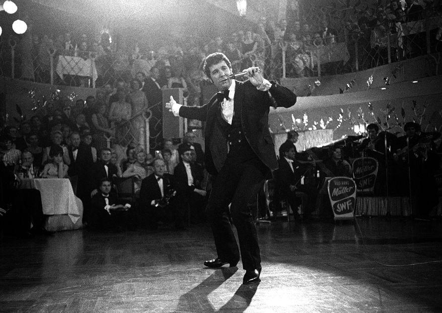 FILE - In this Dec. 31, 1968 file photo, Tom Jones performs at the "Bal Pare" in Munich, Germany. Jones, the Welsh star whose snake hips and stage presence earned comparisons to Elvis Presley, turns 80 on Sunday, June 7. (AP Photo, File)