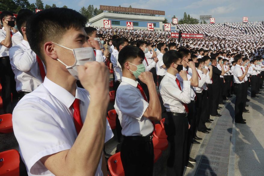 North Korean students stage a rally to denounce South Korea following that defectors and other activists in South Korea flew anti-Pyongyang leaflets over the border, at the Pyongyang Youth Park Open-air Theatre in Pyongyang, Saturday, June 6, 2020. (AP Photo/Jon Chol Jin)