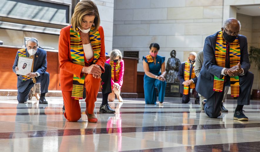 House Speaker Nancy Pelosi of Calif., center, and other members of Congress, kneel and observe a moment of silence at the Capitol&#39;s Emancipation Hall, Monday, June 8, 2020, on Capitol Hill in Washington, reading the names of George Floyd and others killed during police interactions. Democrats proposed a sweeping overhaul of police oversight and procedures Monday, an ambitious legislative response to the mass protests denouncing the deaths of black Americans at the hands of law enforcement.  (AP Photo/Manuel Balce Ceneta)