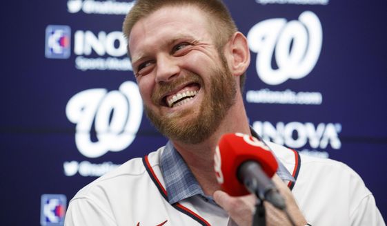 FILE - In this Dec. 17, 2019, file photo, Washington Nationals pitcher Stephen Strasburg smiles during a media availability at Nationals Park in Washington. Baseball’s amateur draft this week will look much different because of the coronavirus pandemic, and more permanent changes could be coming soon. (AP Photo/Alex Brandon, File)