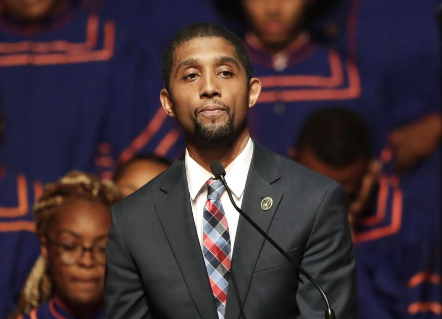 In this Oct. 23, 2019, file photo, then-Baltimore Council President Brandon Scott speaks during a viewing service for the late U.S. Rep. Elijah Cummings at Morgan State University in Baltimore. Now mayor of Baltimore, the city government he leads is being sued by residents with disabilities who complain of a lack of accessibility features like curb ramps and sidewalks. (AP Photo/Julio Cortez, File)  **FILE**