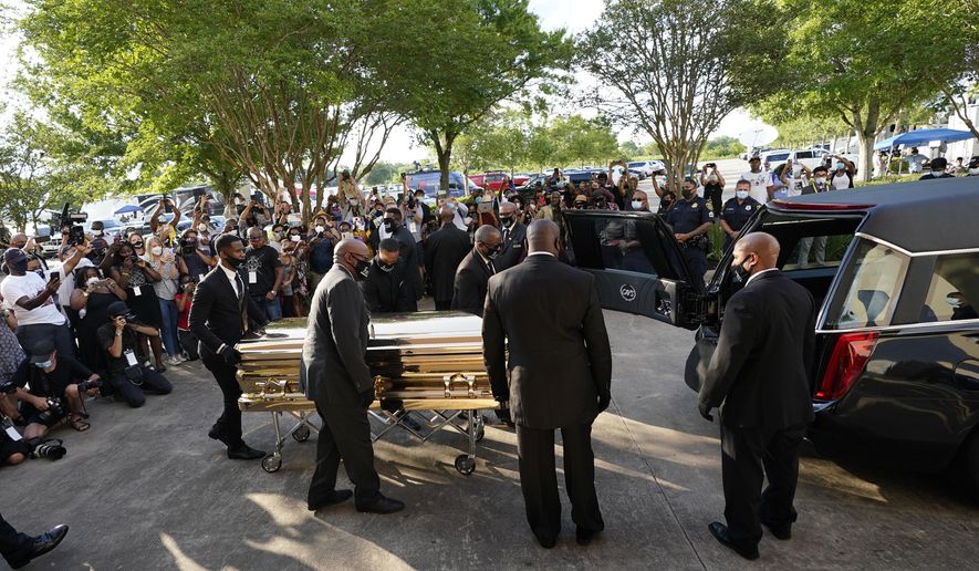 The casket of George Floyd is removed after a public visitation for Floyd at the Fountain of Praise church, Monday, June 8, 2020, in Houston. (AP Photo/David J. Phillip, Pool)