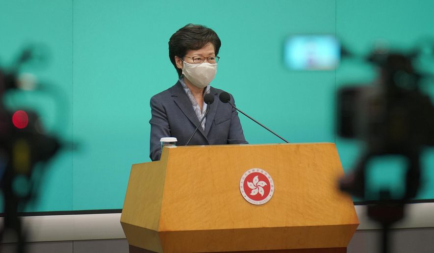 Hong Kong Chief Executive Carrie Lam listens to reporters questions during a press conference in Hong Kong, Tuesday, June 9, 2020. Lam said everyone should learn a lesson from last year's giant anti-government protests. But she did not say what lesson she has learned. Instead, she urged everyone to support the new national security legislation that the central government in Beijing is going to impose on Hong Kong. (AP Photo/Vincent Yu)