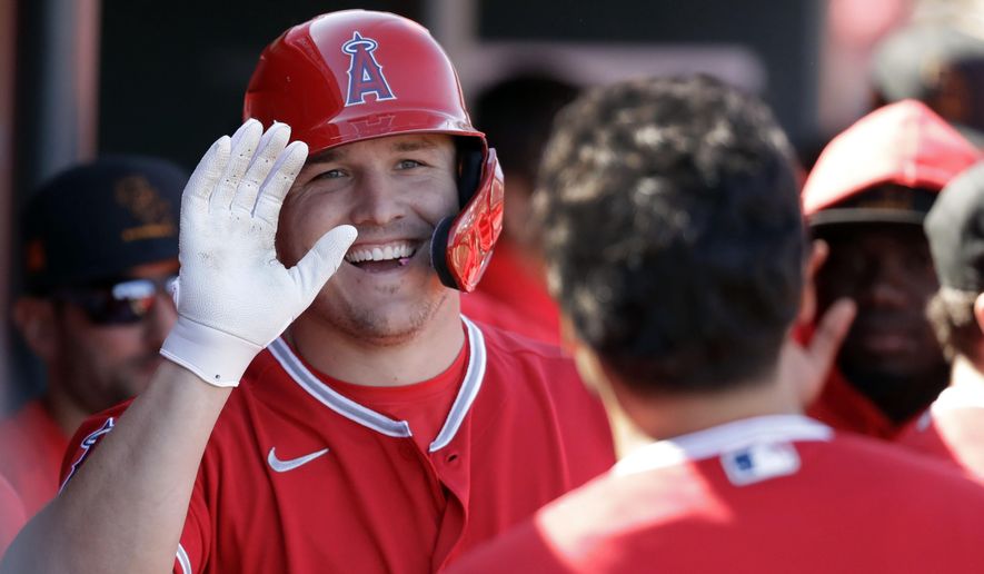 FILE - This Feb. 25, 2020, file photo shows Los Angeles Angels' Mike Trout after scoring during the first inning of a spring training baseball game against the Cincinnati Reds, in Tempe, Ariz. Trout was nominated to the New Jersey Hall of Fame on June 9, 2020. (AP Photo/Darron Cummings, File)