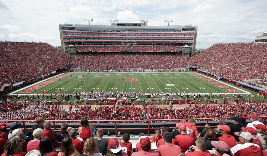 FILE- In this Aug. 31, 2019 file photo, Nebraska fans fill General Memorial Stadium in Lincoln, Neb., during an NCAA college football game between Nebraska and South Alabama. Faced with the possibility college football games will be played in stadiums with reduced capacities as a safeguard against coronavirus, athletic administrators at schools with high ticket demand are making plans to determine who gets a seat. This is a particularly painful task for athletic director Bill Moos of Nebraska, which has sold out every home football game since 1962. The Cornhuskers are a year-round passion in his state. The season ticket renewal rate for the 2020 season is a robust 93 percent. (AP Photo/Nati Harnik, file)