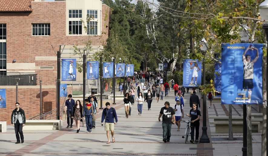Students walk on the University of California, Los Angeles campus. (AP File Photo/Damian Dovarganes, File)