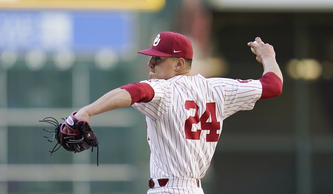 In this Feb. 28, 2020, photo, Oklahoma&#x27;s Cade Cavalli throws a pitch during an NCAA baseball game against Arkansas in Houston. The Washington Nationals selected Cavalli in the baseball draft Wednesday, June 10, 2020. (AP Photo/Matt Patterson)  **FILE**