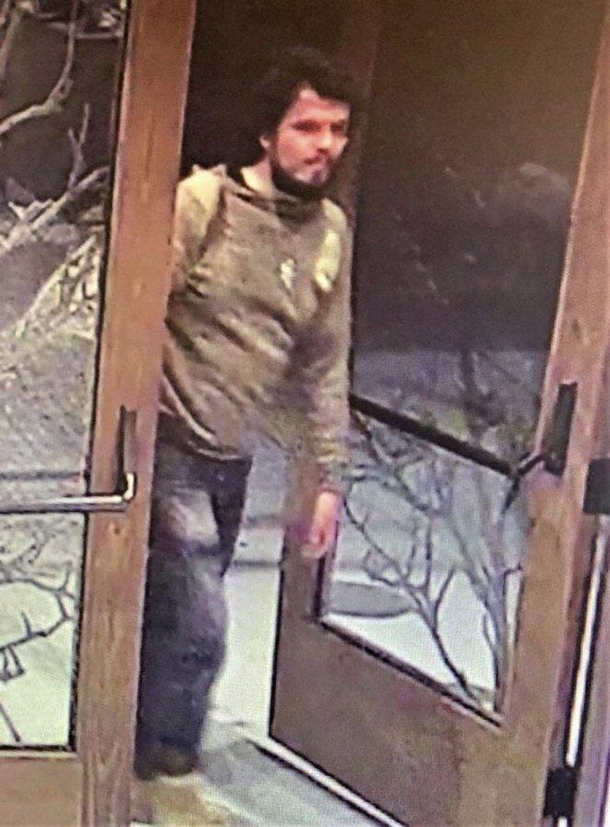 This still image taken from a surveillance camera and provided by the San Luis Obispo County Sheriff's Office seeking the public's assistance in finding a suspect believed to be responsible for a shooting that took place in Paso Robles in the morning on Wednesday, June 10, 2020. Authorities say a California sheriffs deputy was shot in the head in an "ambush" attack by a gunman intent on harming or killing police, The shooter opened fire on a police station. (San Luis Obispo County Sheriff's Office via AP)
