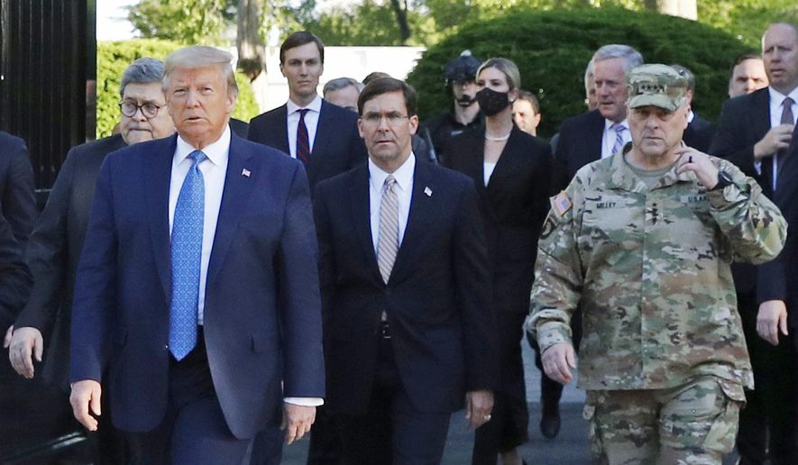 In this June 1, 2020, file photo, President Donald Trump departs the White House to visit outside St. John&#x27;s Episcopal Church, in Washington. Part of the church was set on fire during protests on Sunday night. Walking behind Trump from left are, Attorney General William Barr, Secretary of Defense Mark T. Esper and Gen. Mark Milley, chairman of the Joint Chiefs of Staff. Milley says his presence “created a perception of the military involved in domestic politics.” He called it “a mistake” that he has learned from. (AP Photo/Patrick Semansky)