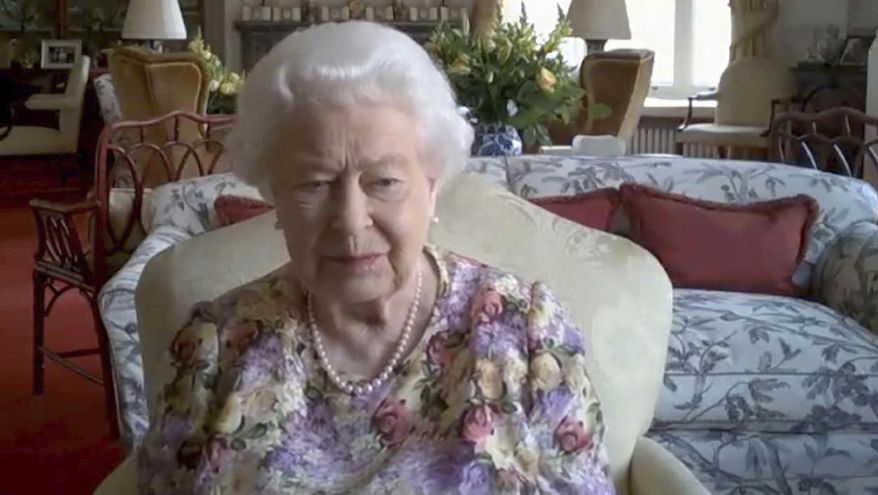 In this video grab issued Thursday June 11, 2020, by Buckingham Palace, showing Britain's Queen Elizabeth II, as she takes part in a video conference call with the Princess Royal Princess Anne, and carers supported by the Carers Trust, on June 4, 2020. The monarch talked with four carers and the trust's chief executive Gareth Howells, on June 4 from Windsor Castle, during the coronavirus pandemic lockdown. As part of Carers Week in the U.K., the 94-year-old monarch showed once again that she's adept at meeting the challenges posed by new technologies, taking part in her first public video conference call to chat to four carers about the challenges they face looking after someone close to them during the coronavirus pandemic. (Carer's Trust/Buckingham Palace via AP)