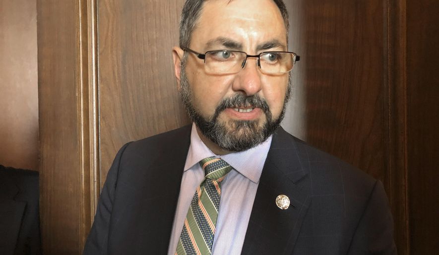 FILE - In this May 15, 2019, file photo, Michigan Senate Appropriations Committee Chairman Jim Stamas, R-Midland, speaks with reporters at the Capitol in Lansing, Mich. Stamas and other key Republican lawmakers on Thursday, June 11, 2020, backed legislation that would waive a requirement that the Legislature pass the next state budget in less than three weeks, citing uncertainty over a major shortfall caused by the coronavirus pandemic. (AP Photo/David Eggert, File)