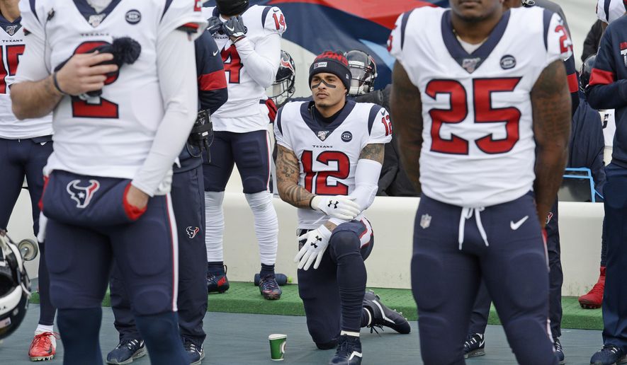 In this Dec. 15, 2019, file photo, Houston Texans wide receiver Kenny Stills (12) kneels during the national anthem before an NFL football game between the Texans and the Tennessee Titans in Nashville, Tenn. NFL players who want to kneel during the national anthem to protest police brutality and racism have far more support than Colin Kaepernick did four years ago. (AP Photo/Mark Zaleski, File)