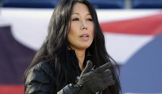 FILE - In this Dec. 23, 2018, file photo, Buffalo Sabres co-owner/president Kim Pegula stands on the field before an NFL football game between the Buffalo Bills and New England Patriots in Foxborough, Mass. Pegula is staying on as Sabres president with a continued focus on making the small-market franchise economically sustainable, while in the face of criticism the team has been mismanaged under her leadership. The team&#39;s co-owner told The Associated Press in a recent interview she believes she remains the best-suited for the job to streamline the operation, while acknowledging the process has taken longer than expected. (AP Photo/Steven Senne, File)