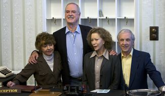 In this file photo dated Wednesday, May 6, 2009, the cast of Fawlty Towers from left, Prunella Scales, John Cleese, Connie Booth and Andrew Sachs reunite to celebrate the 30th anniversary of the TV show and mark a special program &quot;Fawlty Towers: Re-opened&quot; at The Naval and Military Club, London. One of the most memorable episodes of one of the most popular British sitcoms of all-time, Fawlty Towers, has been withdrawn from a streaming service because of numerous racial slurs. (AP Photo/ Edmond Terakopian, FILE)