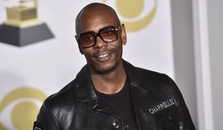 FILE - In this Jan. 28, 2018 file photo, Dave Chappelle poses in the press room with the best comedy album award for &amp;quot;The Age of Spin&amp;quot; and &amp;quot;Deep in the Heart of Texas&amp;quot; at the 60th annual Grammy Awards in New York. Chappelle celebrated George Floyd’s life and ripped the media for the way it handled his death in a surprise Netflix special. The special was released Thursday and is streaming free on Netflix’s comedy YouTube channel.  (Photo by Charles Sykes/Invision/AP, File)