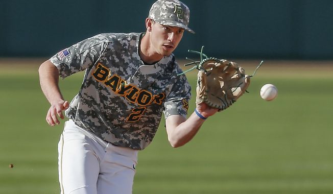 FILE - In this March 16, 2019, file photo, Baylor sophomore shortstop Nick Loftin fields a grounder during the team&#x27;s NCAA college baseball game against Cal Poly in Waco, Texas. The Kansas City Royals selected Loftin in the draft Wednesday, June 10, 2020. (AP Photo/Brandon Wade, File)