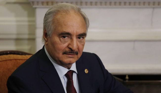 In this Jan. 17, 2020, file, photo, Libyan Gen. Khalifa Hifter joins a meeting with the Greek Foreign Minister Nikos Dendias in Athens. (AP Photo/Thanassis Stavrakis, File)